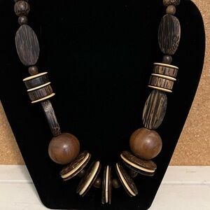 Vintage chunky beaded necklace featuring wood beads. Total length is 32 inches.